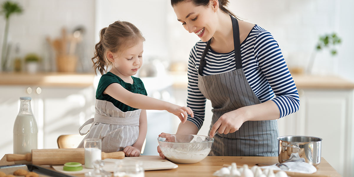 Child cooking with mom can be fun in French