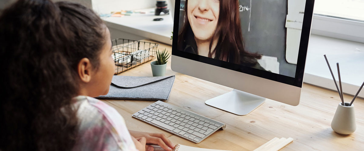 online teacher on a computer