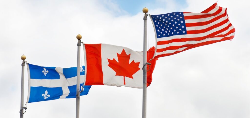 Flags of countries where anglicisms are born or are used. Quebec, Canada and United States of America flags.